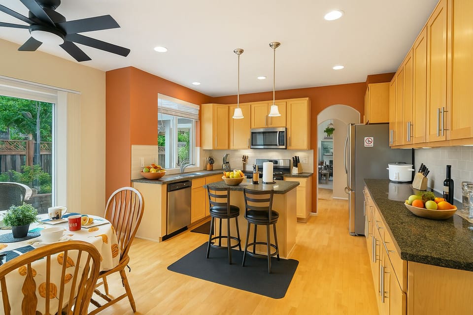 Welcoming dining space for six with yard access—ideal for meals & memories.