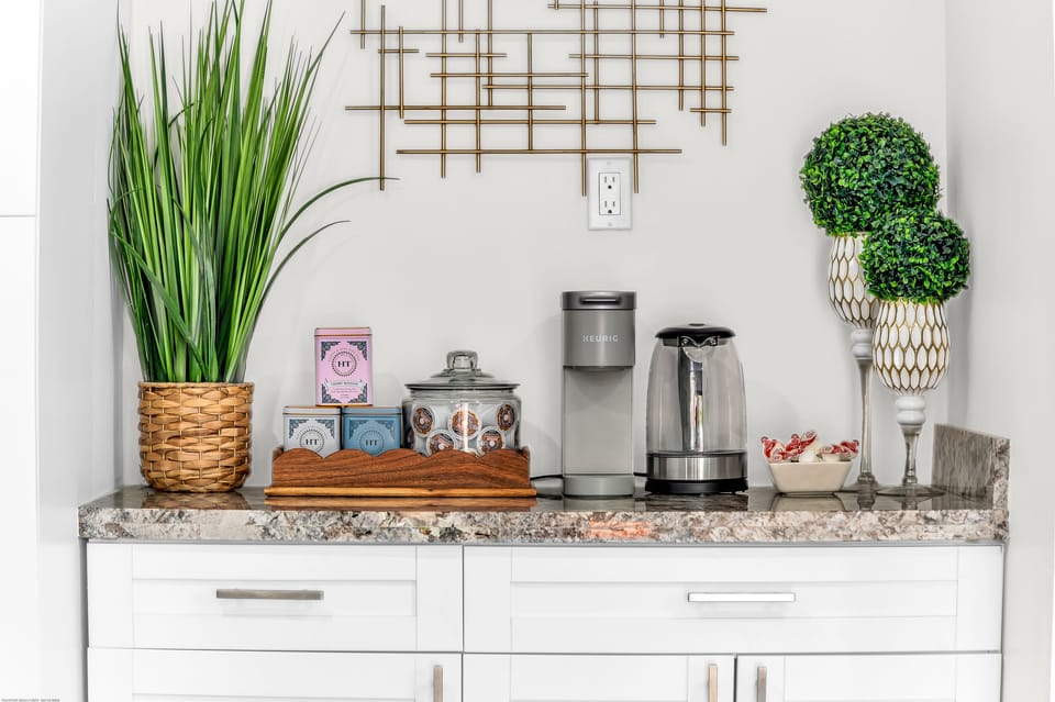 K-cups, sugar, coffee creamer and an assortment of teas always provided