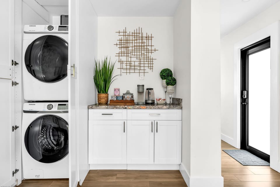 Full size washer and dryer, and a coffee and tea bar stocked with essentials