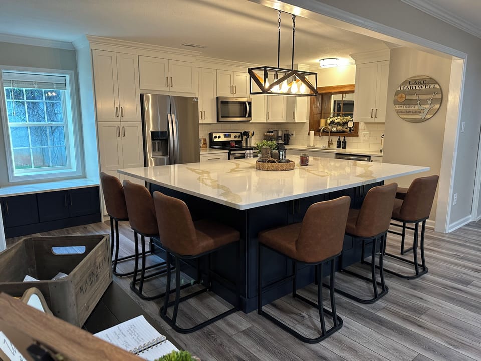 Island table seats 8 but can add more chairs if needed from closet