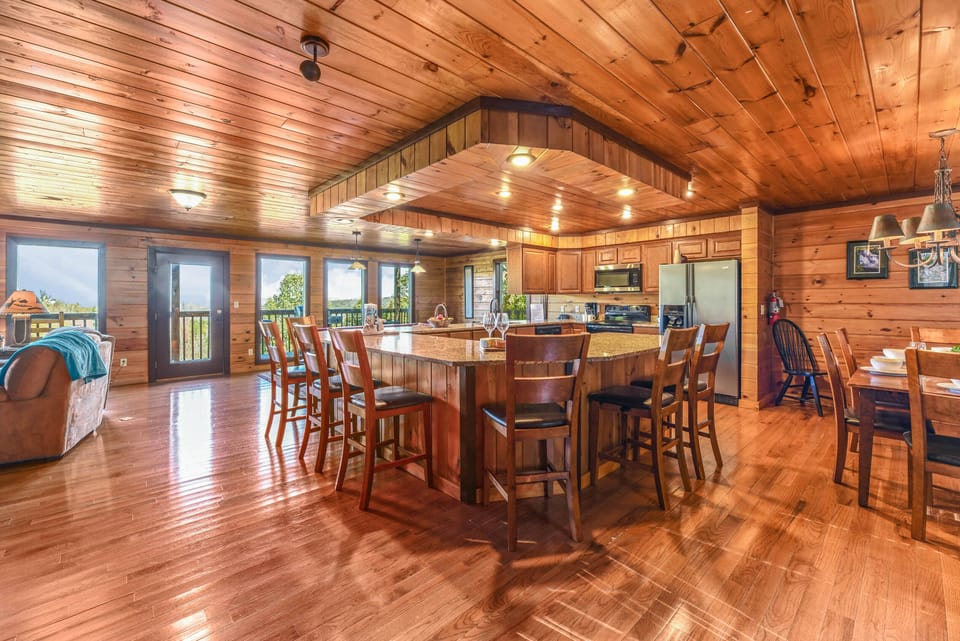【Kitchen + Dining】8 raised chairs surround the fully stocked kitchen for all your entertaining needs!