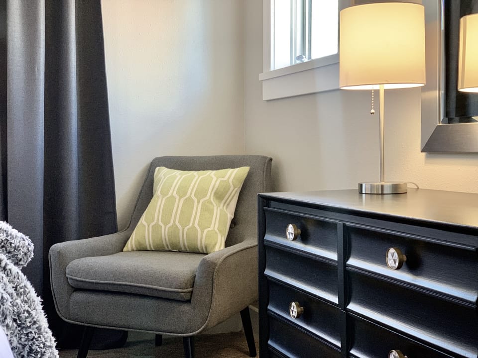 Guest bedroom chair and dresser.