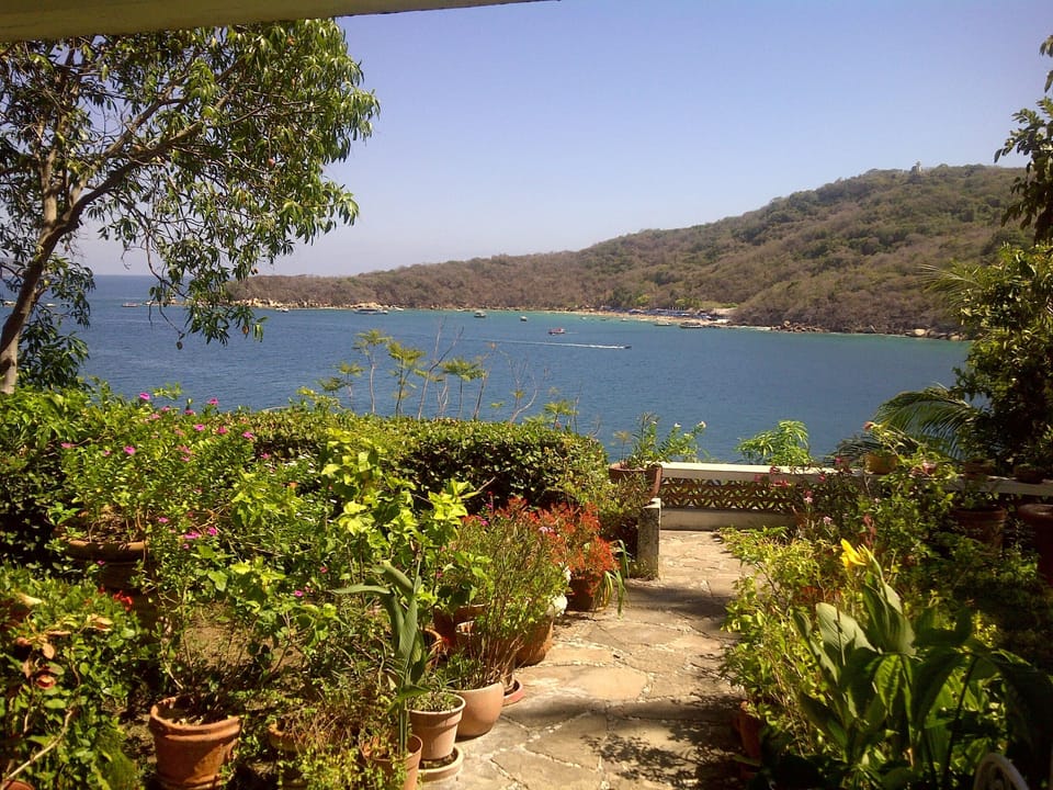 The view from the covered terrace of the sea and the island called Roqueta