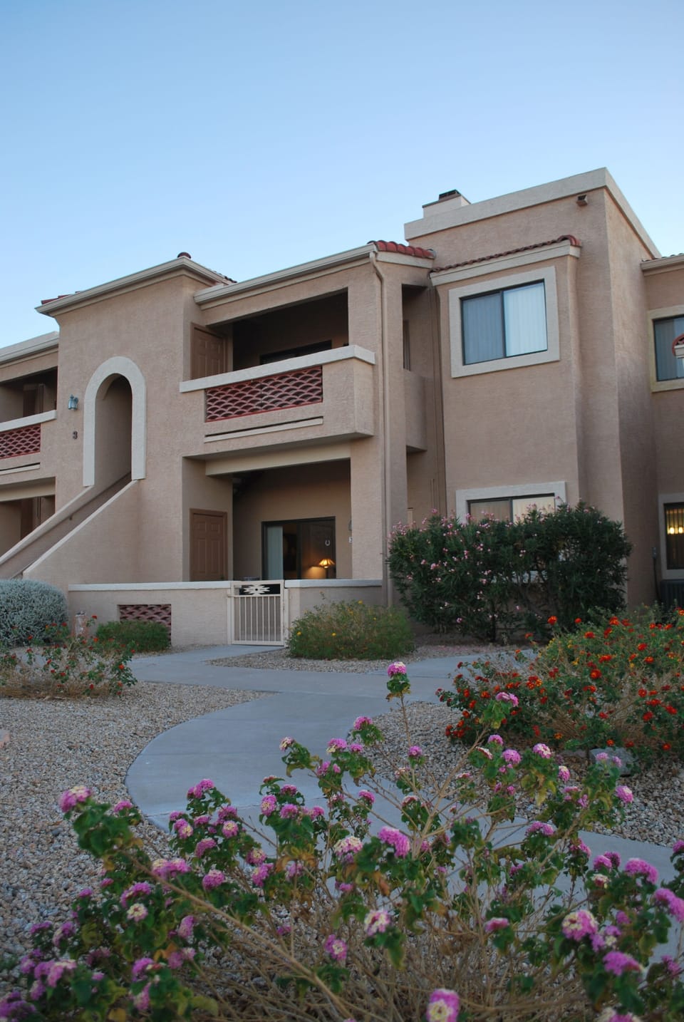 Front view - condo on the lower level, no steps.