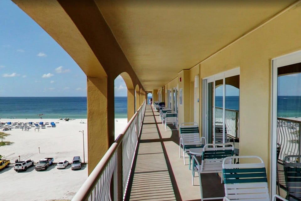 Surfside building with Gulf view balcony seating, outside the unit. 