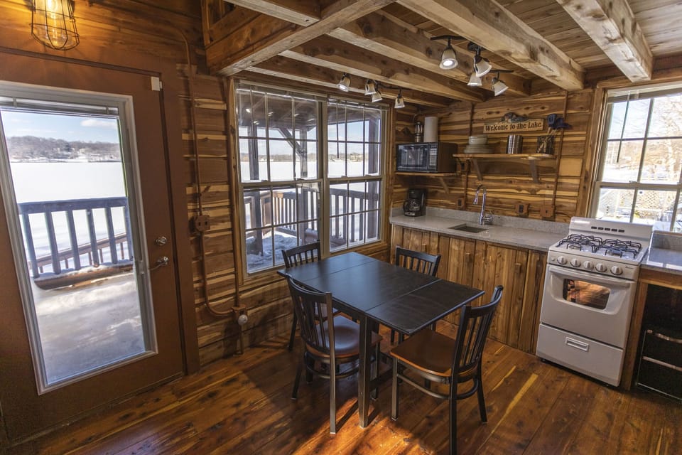 With its leaves open, the kitchen table comfortably seats four. 