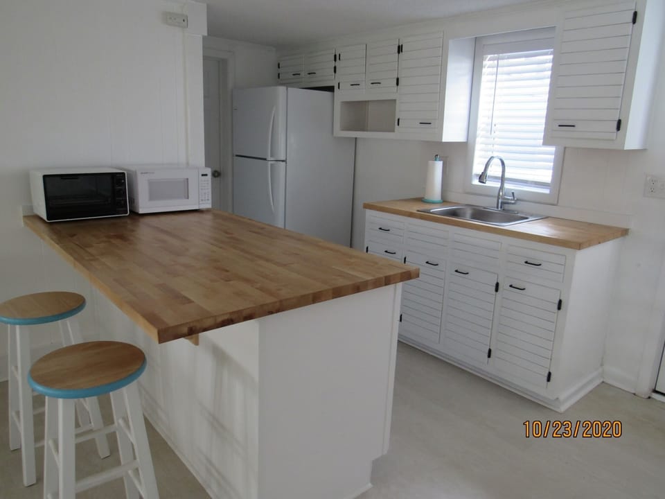 kitchen with refrigerator when you want the kids to go away and cook a pizza.