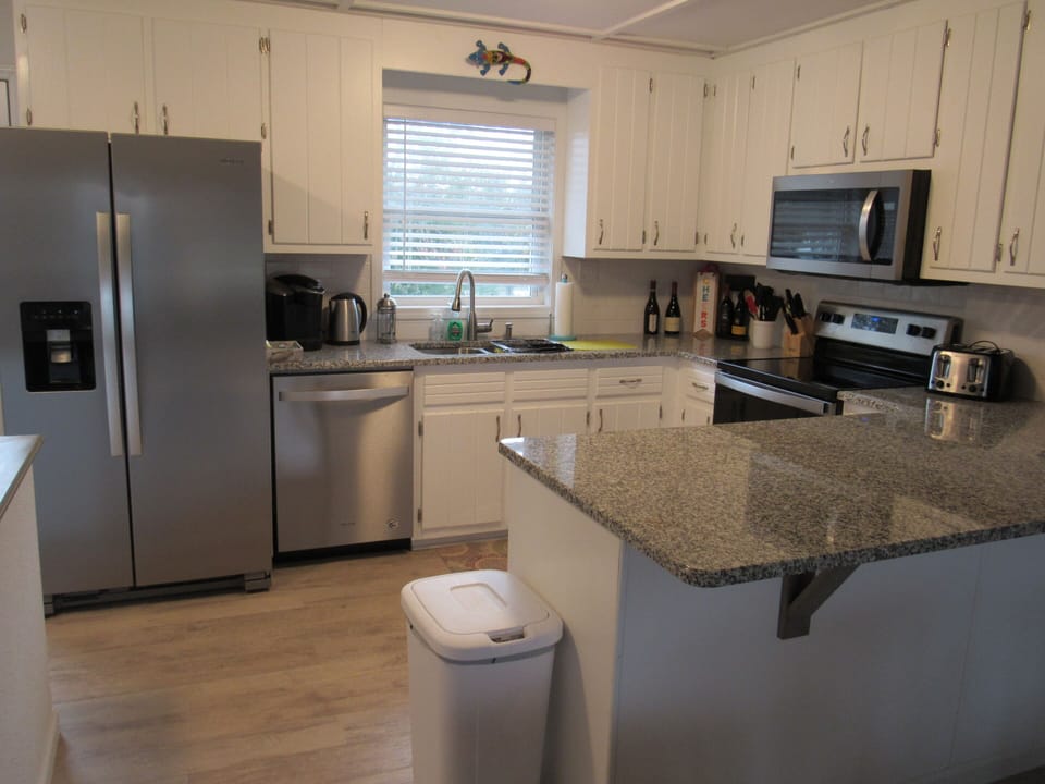 Modern Kitchen with all the amenities to cook should you choose to do so. 