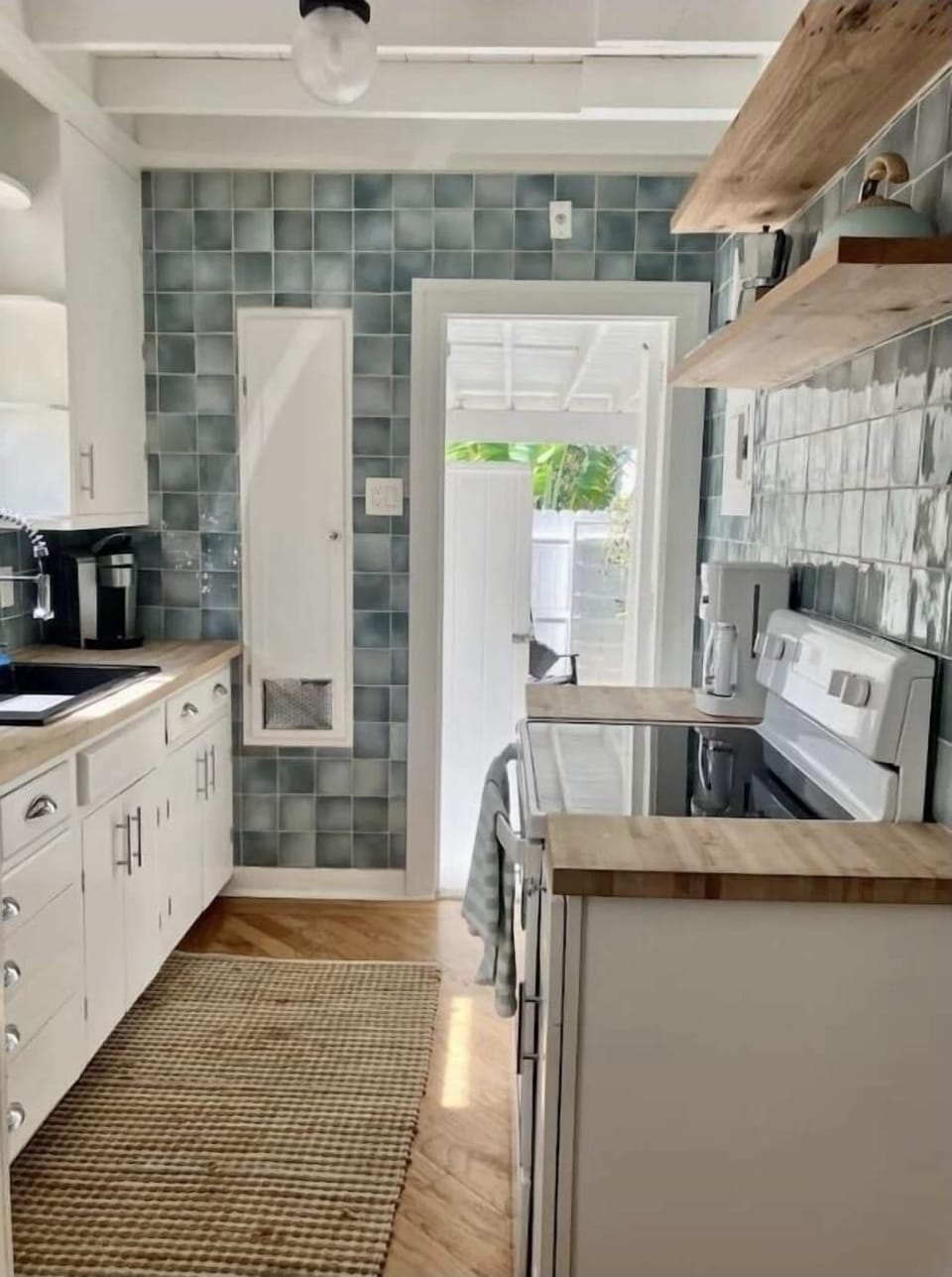 Kitchen - fully stocked including cookware, dishes, and pantry staples.