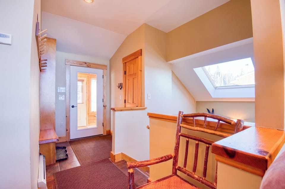 View of entryway and mudroom from living area