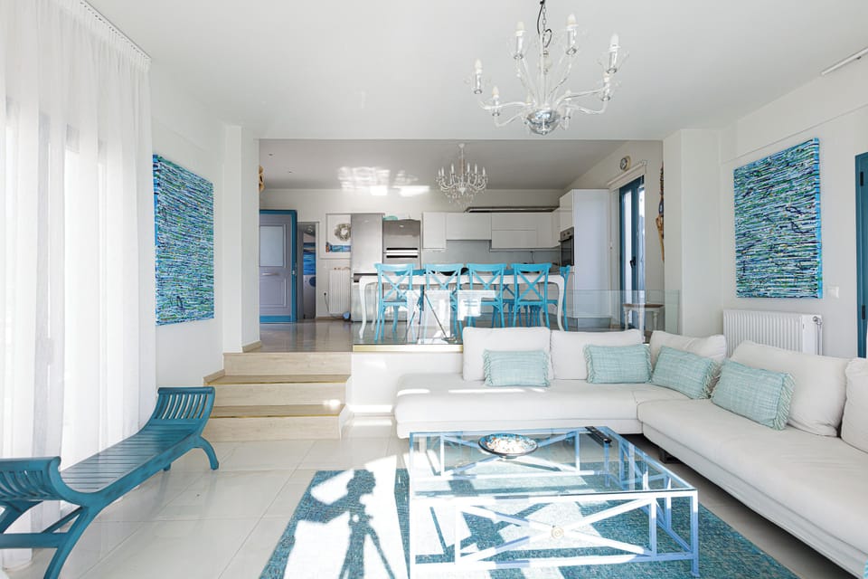 Sunny and airy open-plan living room allows you to host and entertain guests.