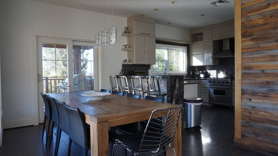 Open concept dining room and living room, with open access to living room. BBQ