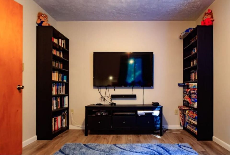 ‘Retro’ entertainment room - VHS & movies, Nintendo 64, board games, books.