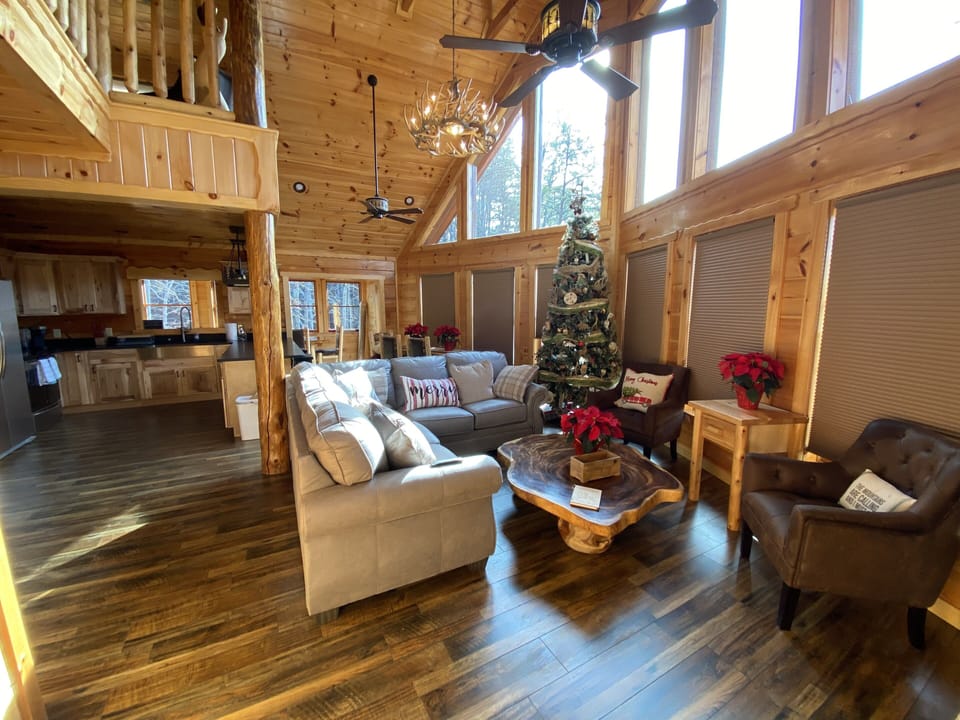 Open floor plan living room by fireplace 