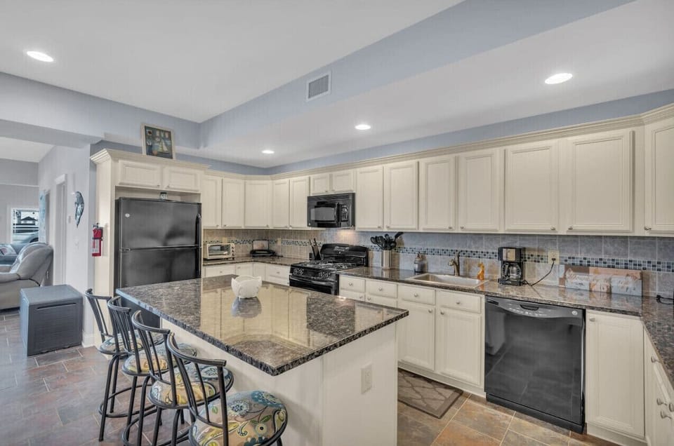 Granite countertops add a polished touch to this spacious 1st floor kitchen