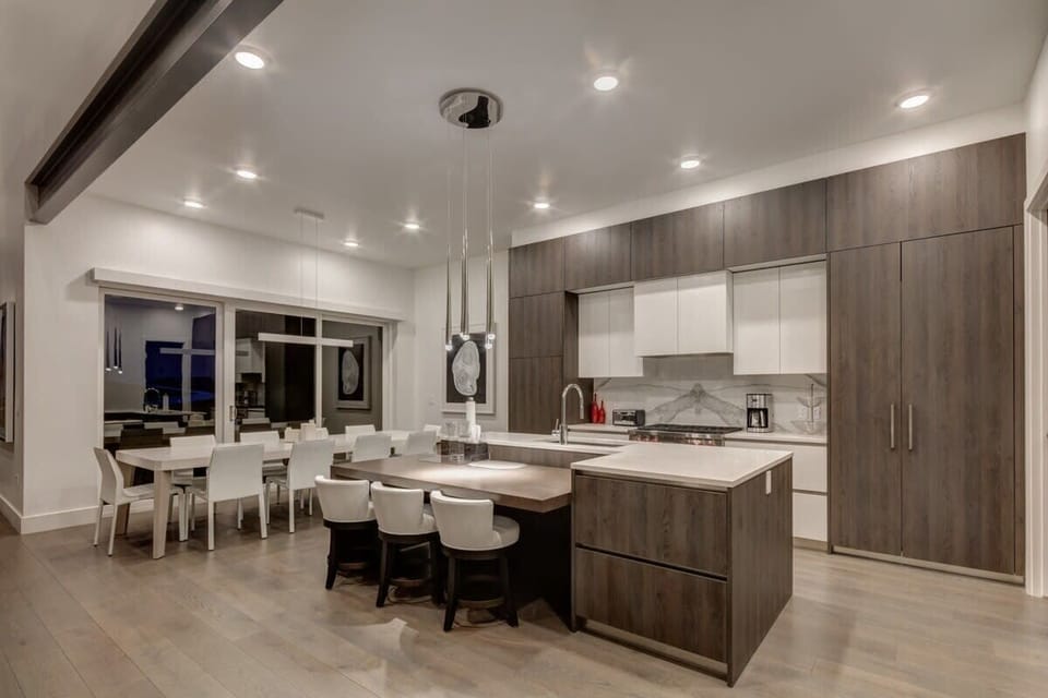 Gourmet Kitchen with Wolf and Sub-Zero appliances, breakfast bar with seating for 3