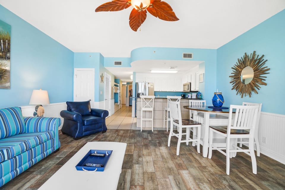 Relax in your bright coastal retreat with ocean-inspired décor, comfy seating, and open-concept living flowing into a fully equipped kitchen.