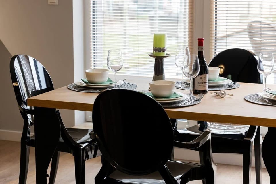 Large table with chairs for eating communal meals. 