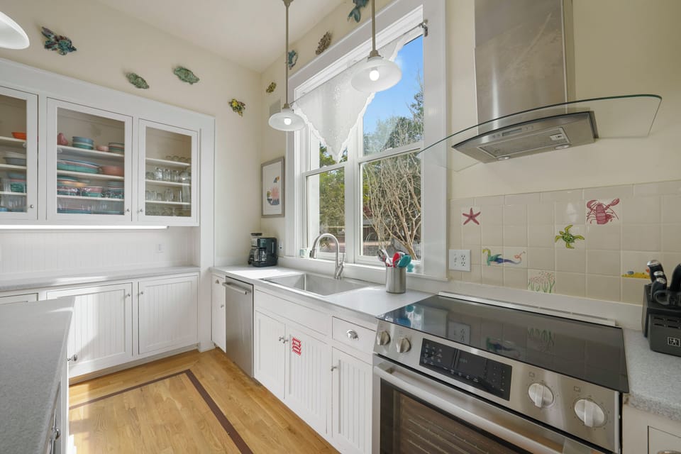 KITCHEN W/FOUR BURNER ELECTRICAL STOVE TOP, PLENTY OF STORAGE