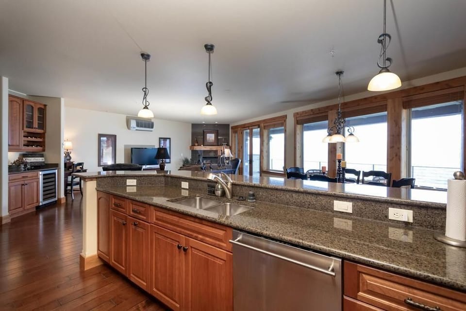 Large open kitchen, dining & living space open to spacious deck.