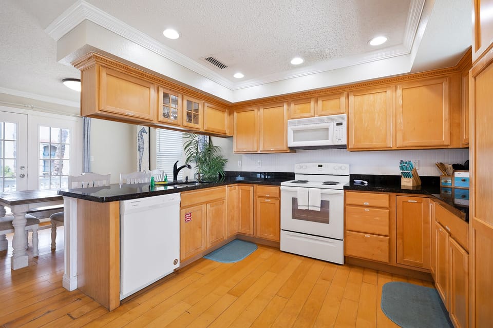 Kitchen is fully stocked with pots, pans, dishwater, glassware &  utensils.