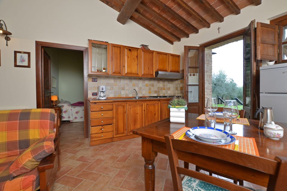 Dining area with kitchenette and sofa bed