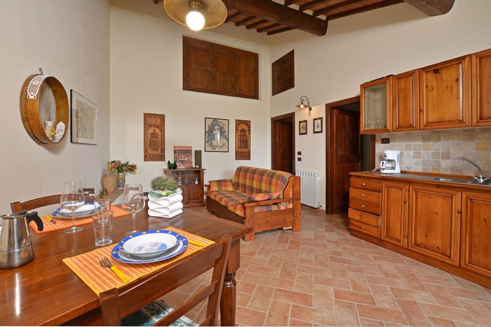 Dining area with kitchenette and sofa bed