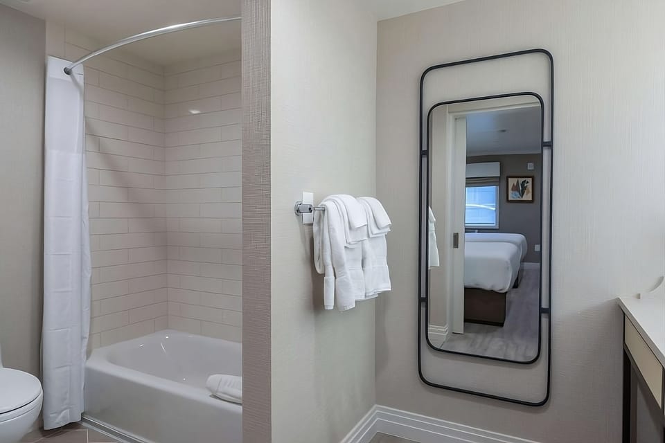 Refresh with a soothing soak in this spotless tiled bath.
