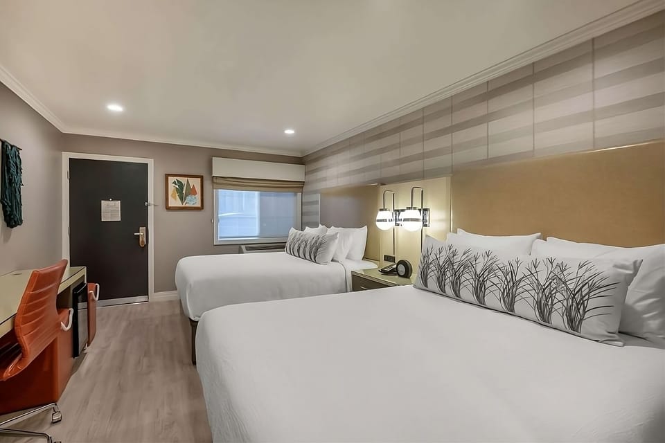 Sink into two cloud-soft queens in this calm retreat.