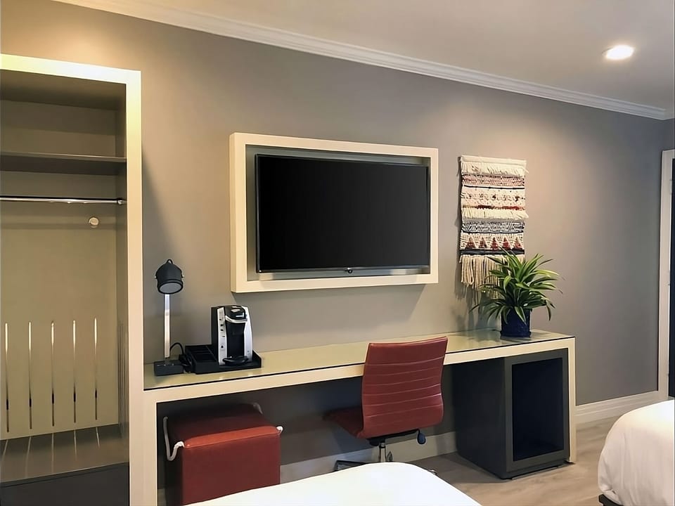 Settle in with a roomy desk, big TV, and coffee.