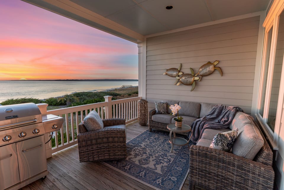 Large outdoor deck with new furnishings + grill. Perfect for sunsets & dolphins!