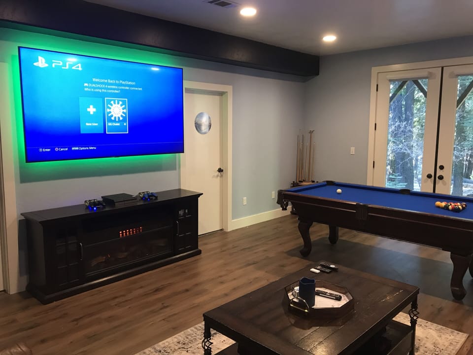 Game room with 82 inch tv, pool table and PS4 with plus subscription.