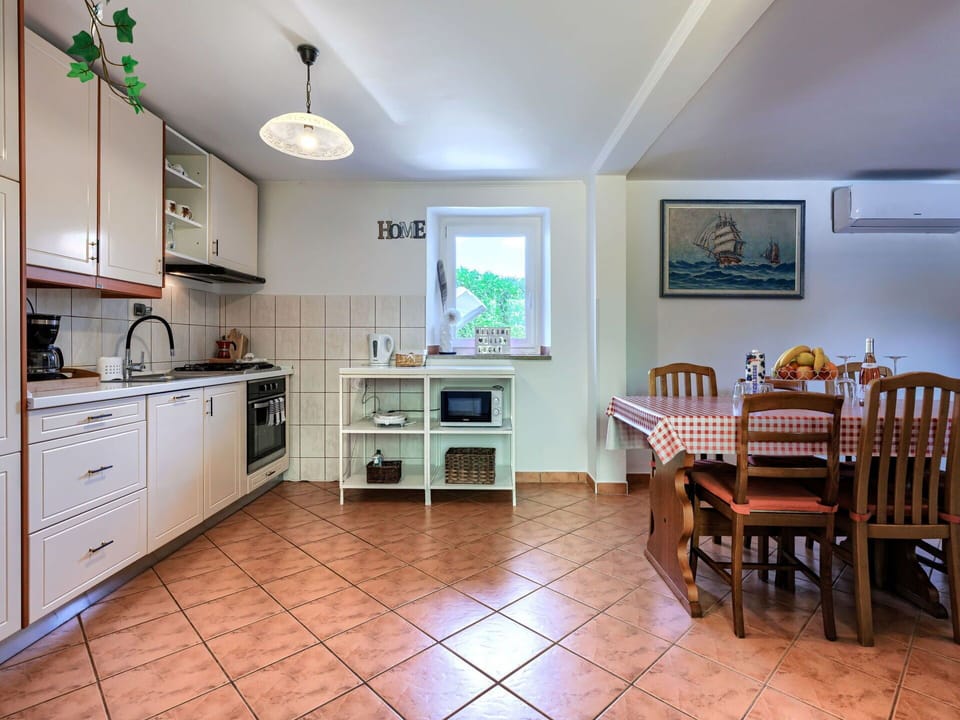 Furniture, Interior Design, Kitchen, Flooring, Ceiling, Wood, Countertop, Floor, Kitchen Appliance, Room