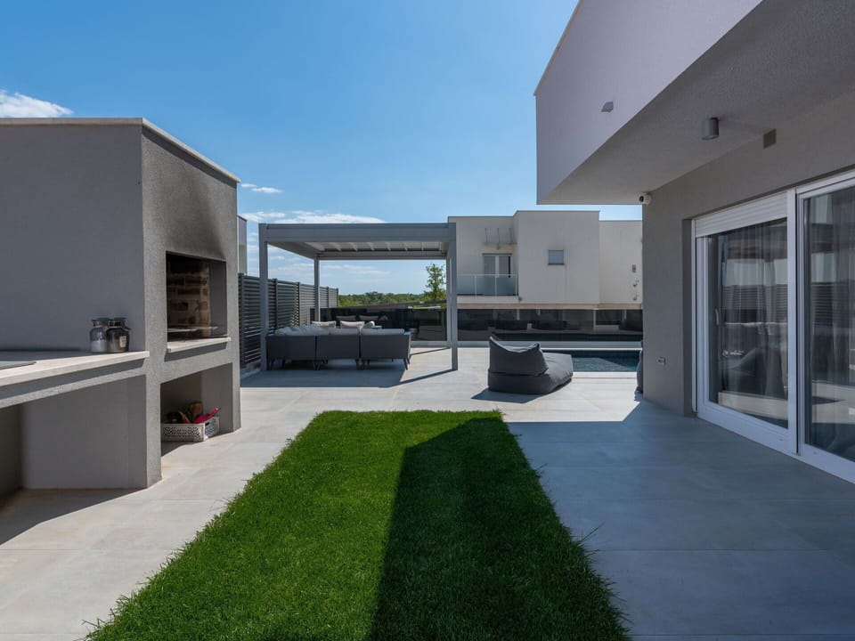 Sky, Shade, Urban Design, Window, Grass, Real Estate, Facade, Condominium, Landscape, Composite Material