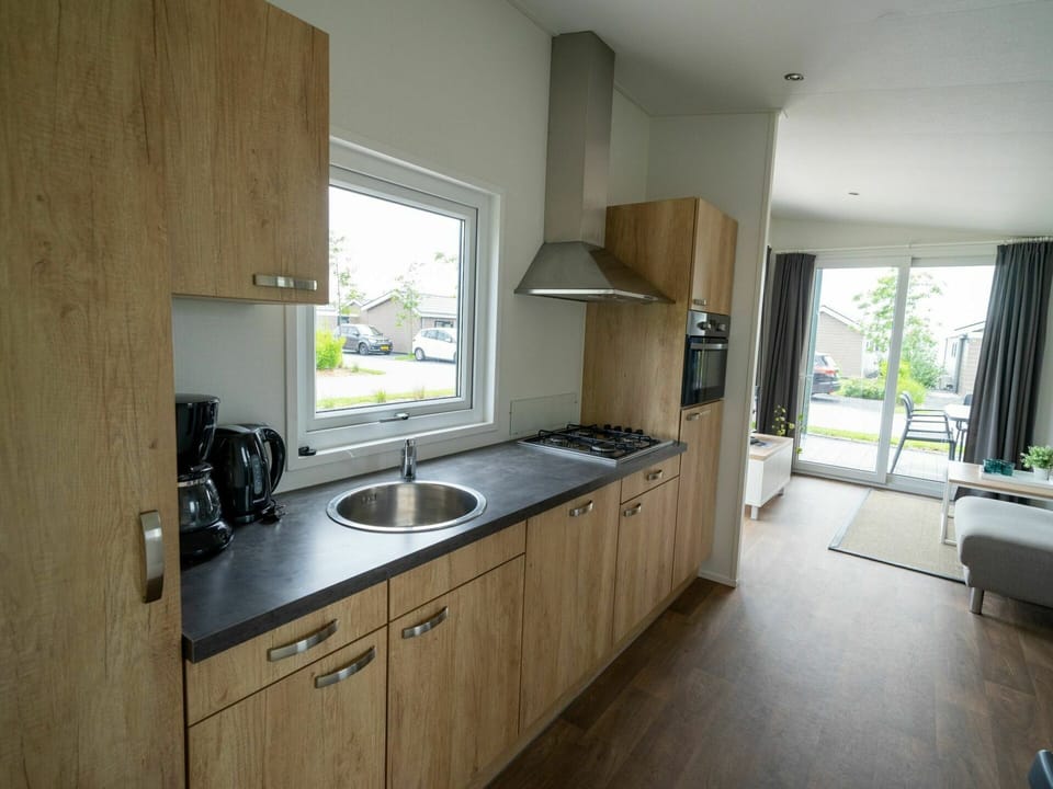 Countertop, Property, Room, Kitchen, Furniture, Sink, Cabinetry, Building, House, Floor