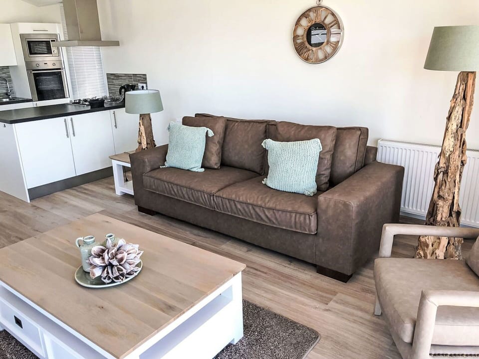 Brown, Furniture, Couch, Property, White, Picture Frame, Interior Design, Wood, Floor, Living Room