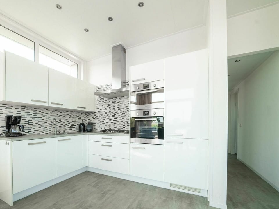 Cabinetry, Countertop, Building, Kitchen Appliance, Kitchen Stove, Wood, Floor, Shelving, Flooring, Kitchen