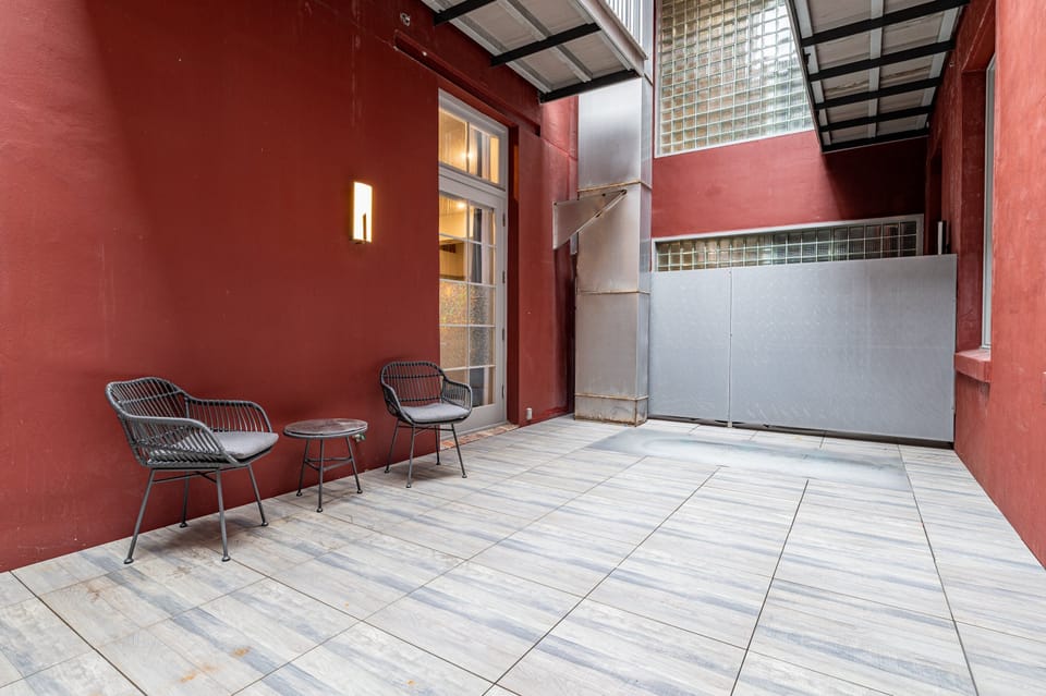 Outdoor patio with seating for two. Perfect for morning and evening relaxing!
