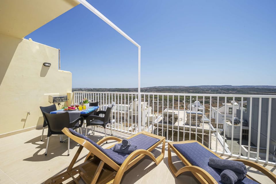 Sunny Terrace with panoramic and distant seaviews. 