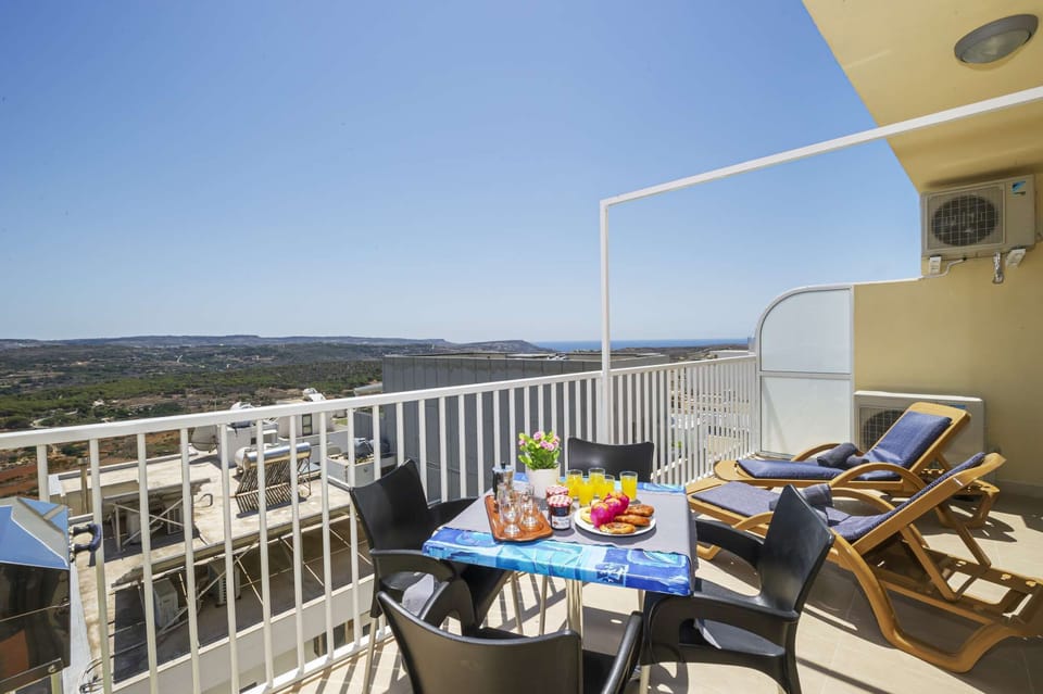 Sunny Terrace with panoramic and distant seaviews. 