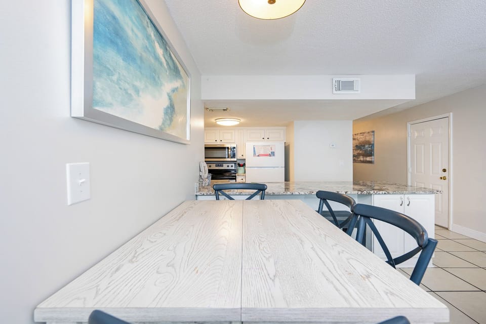 Savor delightful moments at the charming table, perfect for snacks and cozy conversations with loved ones