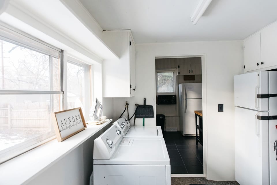 Main floor laundry. (Second fridge has been removed).