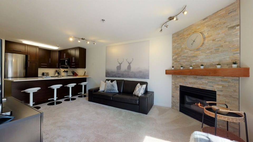 Relax in the spacious living area with Smart TV, gas fireplace, and A/C.