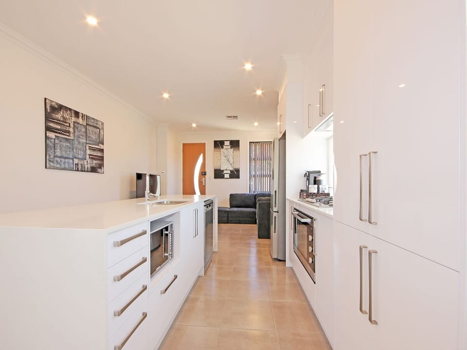 Kitchen with 900w stainless steel appliances including dishwasher