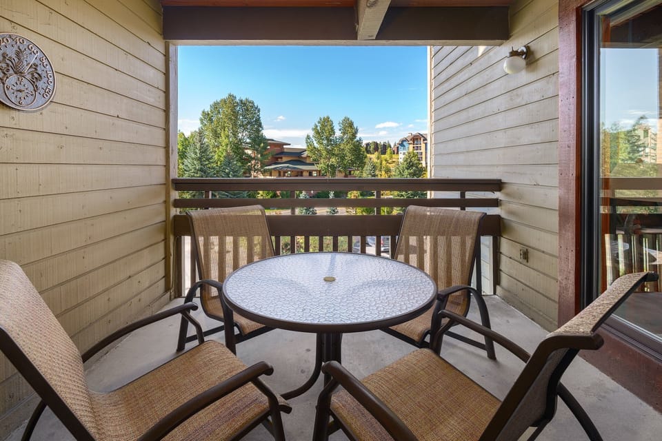Covered patio with table and seating for 4