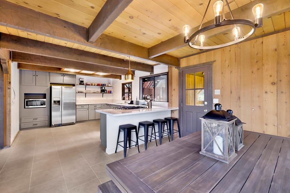 Fully equipped cabin kitchen with ample cabinetry, stove, fridge, microwave, and coffee maker—perfect for cooking meals, morning coffee, and feeling right at home on your stay.