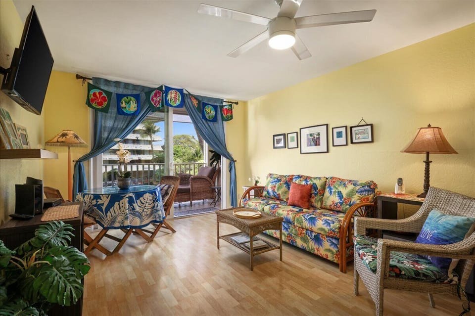 Comfortable living room with soothing ocean sounds and views of the lagoon just below.