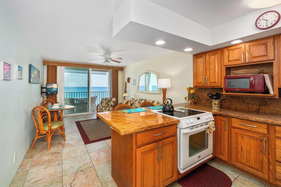 Fully updated kitchen with modern appliances and cookware, perfect for quick snacks or full island-inspired meals.
