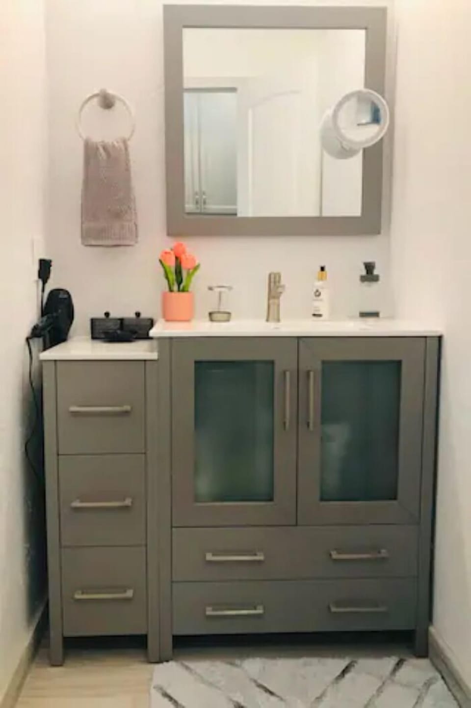 Modern bathroom vanity with ample storage and bright, clean finishes

