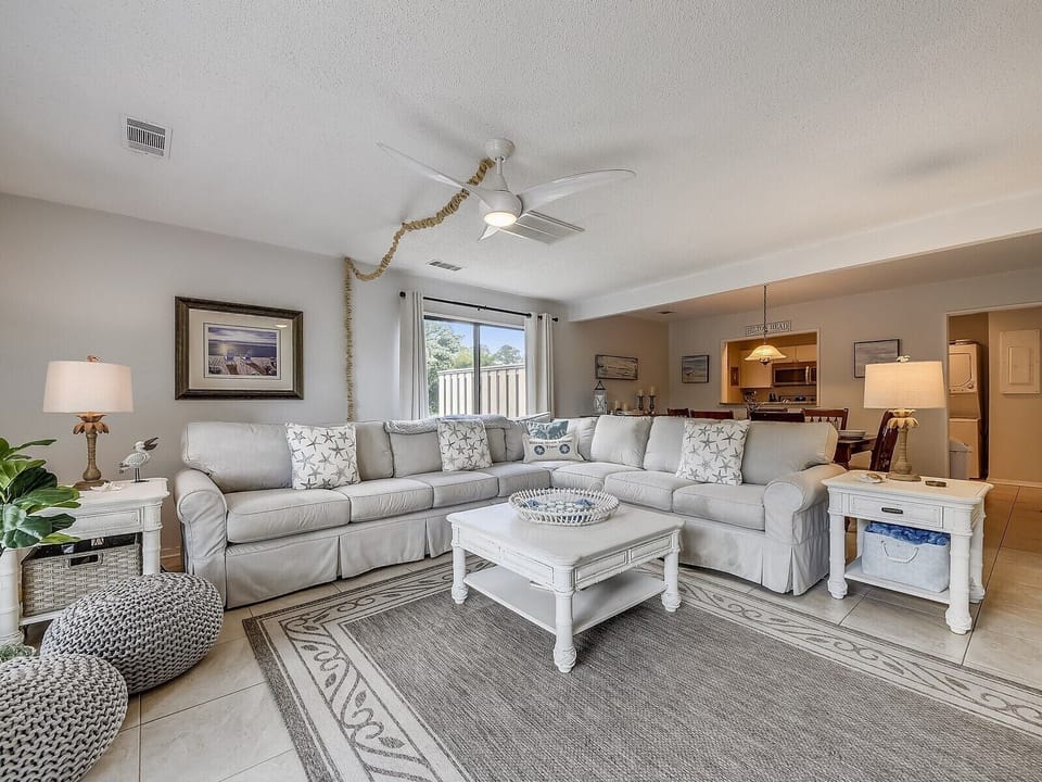 Living Room with Large Sectional Sofa at 680 Queens Grant